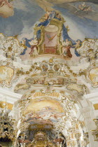 Baroque church  interior view of ornamentation and frescoes painted on celling above main altarReligion Architecture Churches RococoUNESCO World Heritage Site Bayern Deutschland European Religious...
