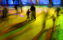 Ice Skaters in motion blur with multi coloured light on a winter ice rink in the city centreWinter Movement Skating Lighting effects Bayern Center Colored Deutschland European Kids M�nchen Western Eu...