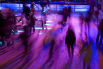 Ice Skaters in motion blur with multi coloured light on a winter ice rink in the city centreWinter Movement Skating Lighting effects Bayern Center Colored Deutschland European Mnchen Western Europe