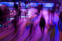 Ice Skaters in motion blur with multi coloured light on a winter ice rink in the city centreWinter Movement Skating Lighting effects Bayern Center Colored Deutschland European M�nchen Western Europe