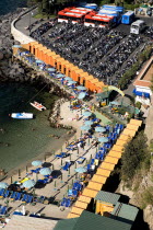 Terrace viewpoint of small beach with beach huts and large car park in backgroundHolidays Italy Transport Beaches Automobile Automotive Cars European Italia Italian Motorcar Resort Sand Sandy Seaside...