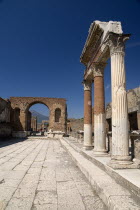 The Forum. Portico in front of the Macellum with arch in the distanceArchaeology Romans Volcanoes Ancient Cities European Italia Italian Pompei Southern Europe History