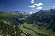 Aran Valley.  River valley landscape with road following the course of the river and electricity pylons.power Catalunya Espainia Espana Espanha Espanya European Hispanic Scenic Southern Europe Spanis...