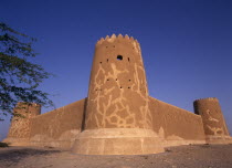 View of walls and crenellated tower of a fort built in 1938 and used as a police border post  now a museum.  Al Zubarah or Az Zubarah History Middle East Qatari