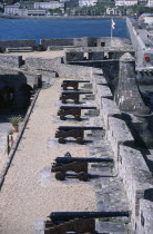 St Peter Port. Castle Cornet. Black Cannons lined up next to castle wall.European Northern Europe Castillo Castello History Scenic