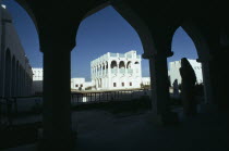 Doha Museum with visitors walking through archesMiddle East Qatari