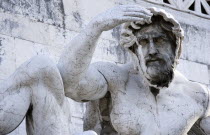 Detail of a fountain representing the Adriatic Sea in Brescian marble on the Victor Emmanuel Monument of a statue of a man shading his eyes from the sunEuropean Italia Italian Roma Southern Europe Gr...