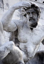 Detail of a fountain representing the Adriatic Sea in Brescian marble on the Victor Emmanuel Monument of a statue of a man shading his eyes from the sunEuropean Italia Italian Roma Southern Europe Gr...