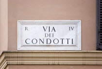 Marble street sign on a wall for Via Dei Condotti the high fashion shopping streetEuropean Italia Italian Roma Southern Europe