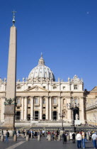 Vatican City The Basilica of St Peter and the Piazza San Pietro with tourists in the square beside the ObeliskEuropean Italia Italian Roma Southern Europe Catholic Principality Citta del Vaticano Hol...