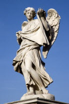 Statue of a winged female angel on the Ponte Sant Angelo bridge over the River TiberEuropean Italia Italian Roma Southern Europe Gray History Religion Religious