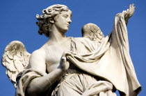 Statue of a winged female angel on the Ponte Sant Angelo bridge over the River TiberEuropean Italia Italian Roma Southern Europe Gray History Religion Religious