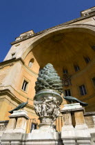 Vatican City Museums The Cortille della Pigna a huge bronze pine cone from a Roman fountain in a niche below the Papal heraldic crest in a niche by Pirro Ligorio on the Belvedere PalaceEuropean Itali...