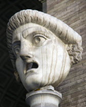 Vatican City Museums A carved face with gaping open mouth in the Octagonal Courtyard of the Belvedere PalaceEuropean Italia Italian Roma Southern Europe Catholic Principality Citta del Vaticano Gray...