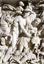 Vatican City Museums Detail of a marble sarcophagus in the Octagonal Courtyard of the Belvedere Palace depicting a battle scene with one soldier helping another injured soldierEuropean Italia Italian...