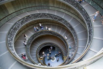 Vatican City Museums Tourists descending the Spiral Ramp designed by Giuseppe Momo in 1932 leading from the museums to the street level belowEuropean Italia Italian Roma Southern Europe Catholic Prin...