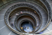 Vatican City Museums Tourists descending the Spiral Ramp designed by Giuseppe Momo in 1932 leading from the museums to the street level belowEuropean Italia Italian Roma Southern Europe Catholic Prin...