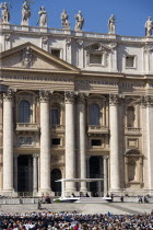 Vatican City Pope Benedict XVI under a canopy during an audience in Piazza San Pietro in front of the Basilica of Saint Peter with crowds in the squareEuropean Italia Italian Roma Southern Europe Cat...