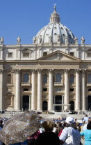 Vatican City Pope Benedict XVI under a canopy during an audience in Piazza San Pietro in front of the Basilica of Saint Peter with crowds in the squareEuropean Italia Italian Roma Southern Europe Cat...