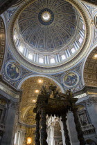 Vatican City The Basilica of St Peter The Dome by Michelangelo above the canopied Baldacchino by Bernini with his Throne of Saint Peter in Glory beyondEuropean Italia Italian Roma Southern Europe Cat...