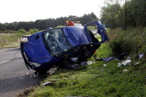 Scene of a road accident invoving a blue Peugeot car.RTA Automobile Automobiles Automotive Autos Cars European Motorcar Crash Automvil