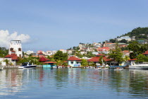 The new Peter de Savary marina development of Port Louis with the capital city of St Georges beyond. Eco tourists in rubber dingies leave the jetty to explore the coastlineCaribbean Grenadian Greneda...