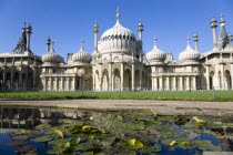 The onion shaped domes of the 19th Century Pavilion designed in the Indo- Saracenic style by John Nash commissioned by George Prince of Wales later to become King George IV. The oval water lilly pond...