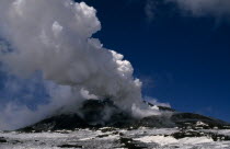 Smoke and ash rising from the snow covered volcanoItalia Italian Southern Europe Ecology Entorno Environmental Environnement European Green Issues Scenic