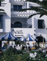 Villas in an Arab style. Tourists sitting at tables outside cafe African Arabic Bar Bistro Holidaymakers Middle East North Africa Restaurant Tourism Inn Northern Pub Tavern