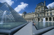 The Louvre art gallery with a part of the Pyramid and fountains in the foregroundFrench Western Europe European