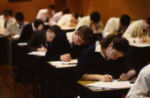 Students sitting A level examination.European Immature Kids Learning Lessons Teaching