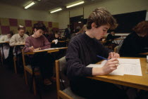 Students sitting A Levels. GCSETest Examination European Immature Kids Learning Lessons Teaching