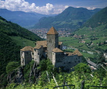 View over distant mountain village Karneid castle in foreground Summer time Castillo Castello European Italia Italian Southern Europe Castle Castello Castle Castillo