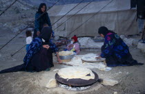 Qashqai nomad family making bread at a camp in the Zagros Mountains. Iranian Kids Middle East
