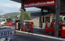 Star Of The Jamaican Road petrol station with attendant filling Toyota pick-up truck.Ecology Entorno Environmental Environnement Gasoline Green Issues Lorry Van West Indies