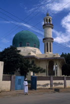 Mosque with green dome. Man stood outside the open gate.African Male Men Guy Nigerian One individual Solo Lone Solitary Religion Religious Western Africa 1 Male Man Guy Single unitary