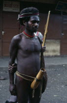 Wamena.  Dani warrior wearing penis gourd.Asian One individual Solo Lone Solitary Southeast Asia Southern