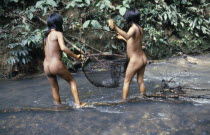 Two Auca Indian girls fishing with net.Waorani 2 American Equador Hispanic Latin America Latino South America Southern