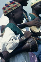 Child musician playing bongo drums.Percussion InstrumentDrumsAfrican Children Kids Nigerian Western Africa