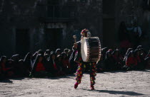 Masked Taquile drummer performing for Yuyachkani folkloric group.Percussion InstrumentDrumsAmerican Hispanic Latin America Latino Performance Peruvian South America Southern Public Presentation