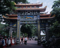 Entrance to Haw Par Villa and Tiger Balm Gardens with people walking through below.Asian Holidaymakers Singaporean Singapura Southeast Asia Southern Tourism Tourist Xinjiapo