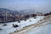 Cityscape and traffic in snow.Former USSR Soviet European Georgian Sakartvelo Scenic Western Asia Asian