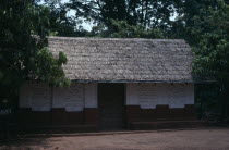 Traditional thatched house with intricate patterns on walls.African Asante Classic Classical Ghanaian Historical History Older Western Africa