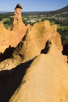 Cheminee de Fee or Fairy Chimneys.  Early morning light on eroded  ochre rocks in area known as Colorado Provencal.Ochre Trail European French Western Europe