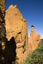 Cheminee de Fee or Fairy Chimneys.  Morning light on eroded ochre rock pinnacles in area known as Colorado Provencal. Ochre Trail European French Western Europe