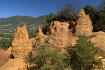 Colorado Provencal.  Cheminee de Fee or Fairy Chimneys.  Eroded ochre rock forms and surrounding landscape from viewpoint.Ochre Trail European French Western Europe