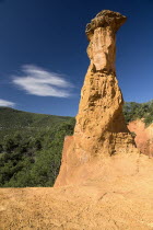 Colorado Provencal.  Cheminee de Fee or Fairy Chimneys.  Capped  eroded ochre rock pinnacle in evening lightOchre Trail European French Western Europe Warm Light