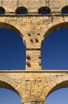 Pont du Gard.  Close up detail of section of the three tiers of continuous arches of Roman aqueduct.Bridge arch stone European French Western Europe