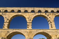 Pont du Gard.  Close up detail of section of three tiers of continuous arches of Roman aqueduct.Bridge arch stone European French Western Europe