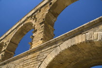 Pont du Gard.  Close up detail of section of tiered arches of Roman aqueduct.Bridge arch stone European French Western Europe